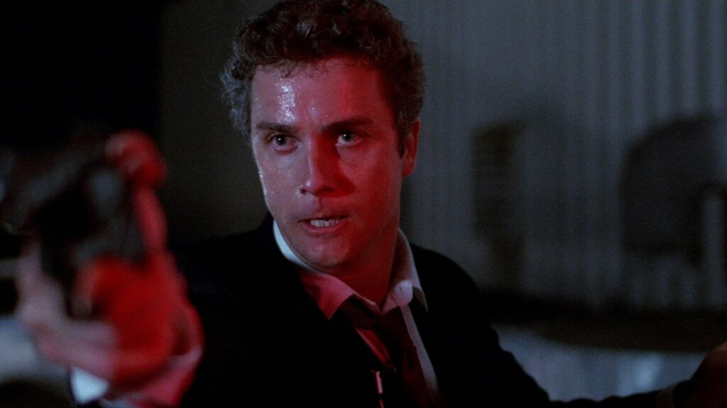 Cop Richard Chance point a gun