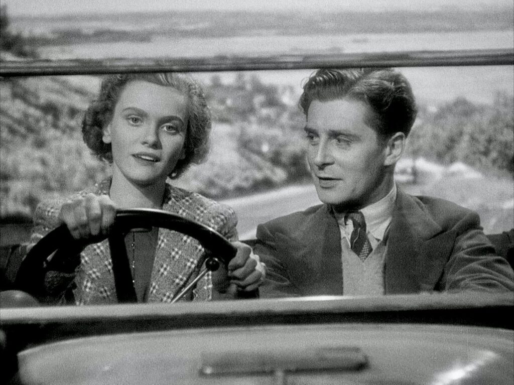 Nova Pilbeam and Derrick De Marney in a car