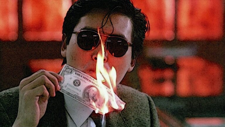 Chow Yun-fat lights a cigarette with counterfeit money