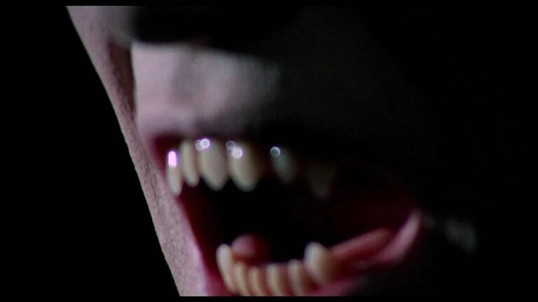 Close up of Count Yorga's fangs