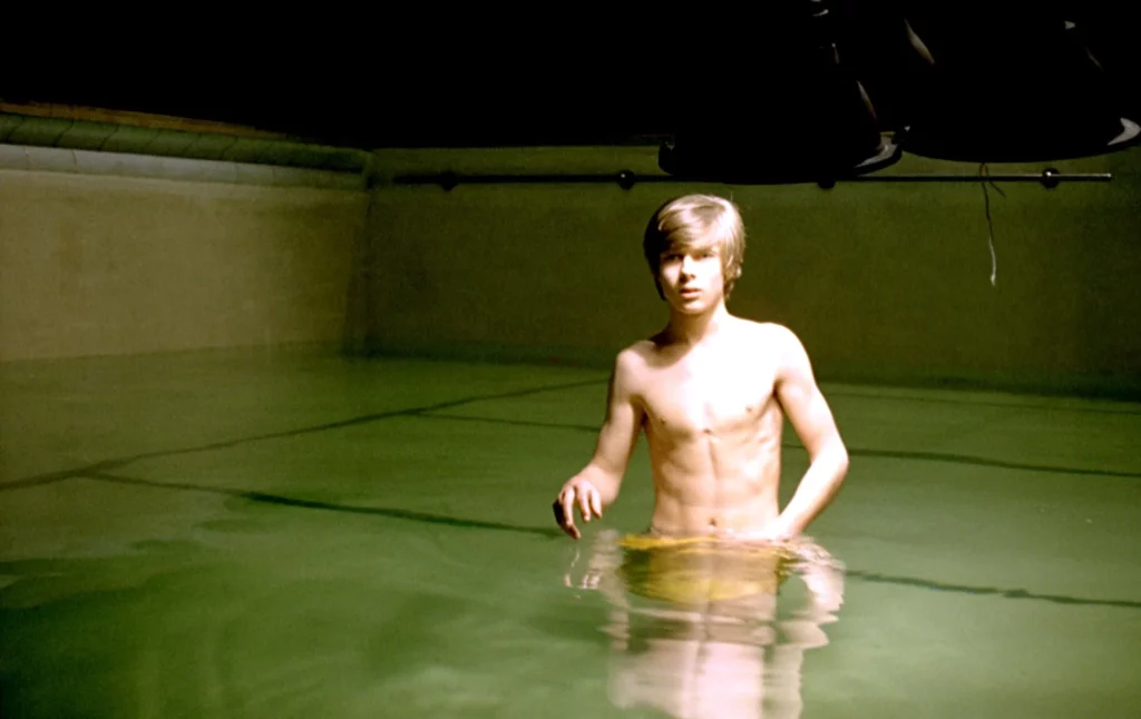 Mike, naked in the swimming pool