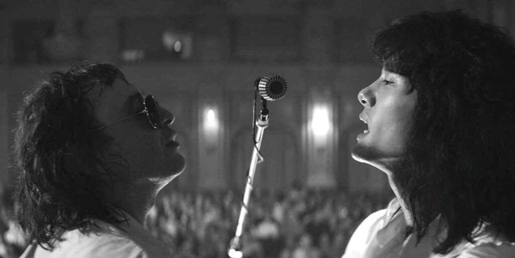 Mike and Viktor sing together on stage