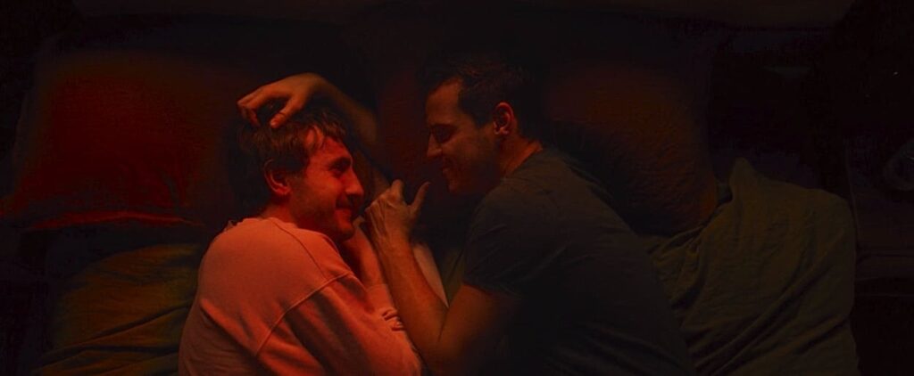 Harry and Adam talk in bed