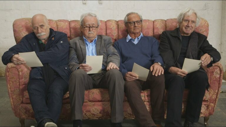 Four men at the casting call sit on the sofa