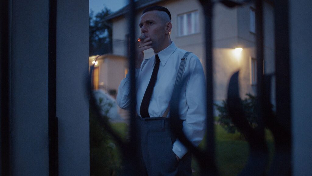 Rudolf Höss enjoys a cigarette after dinner