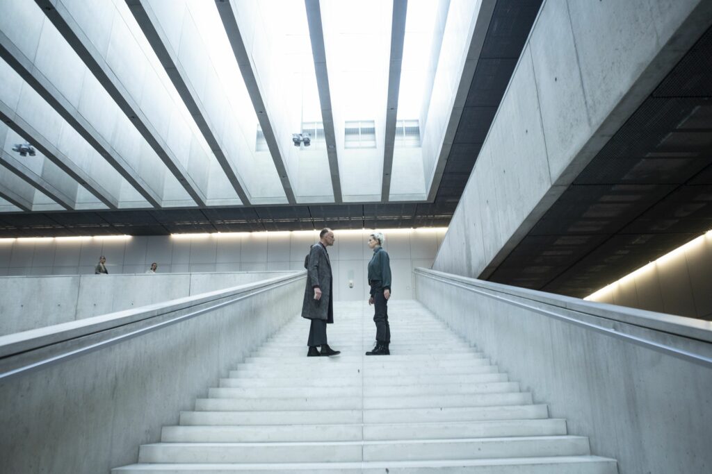 Karel Dobrý and Andrea Mohylová on a modernist staircase