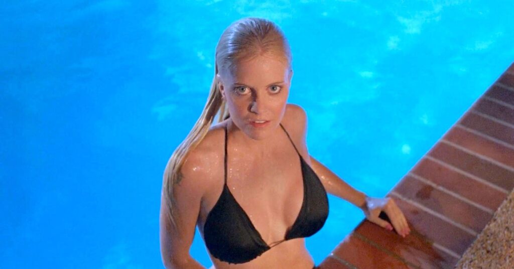Fawn in a black bikini top