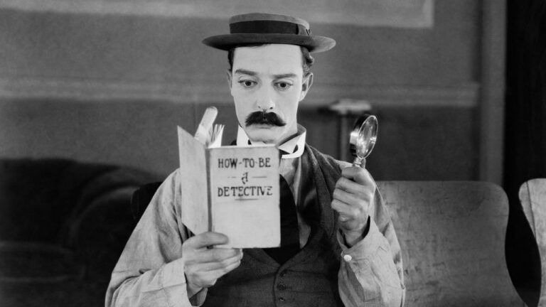 The projectionist reads a book on how to be a detective