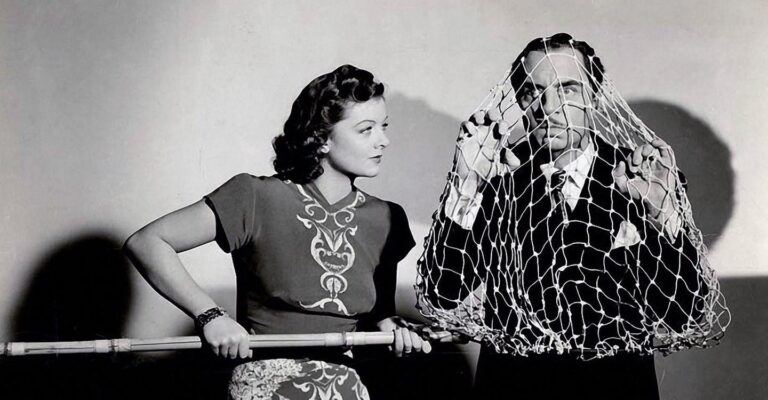 Myrna Loy and William Powell goof about for a publicity shot