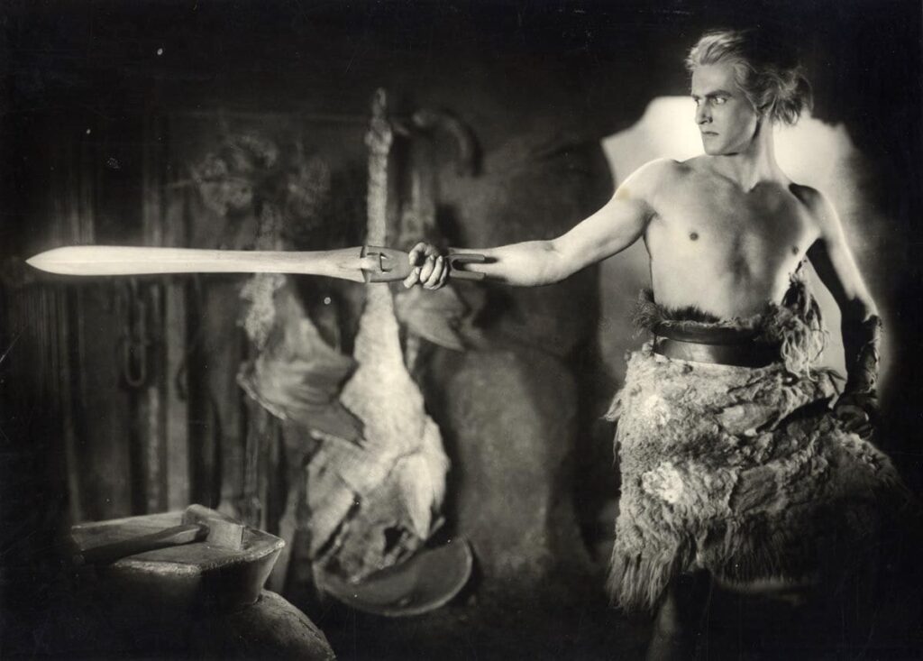 Siegfried checks his sword before setting out