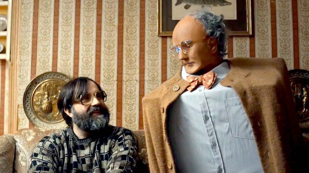 Brian and Charles look at each other