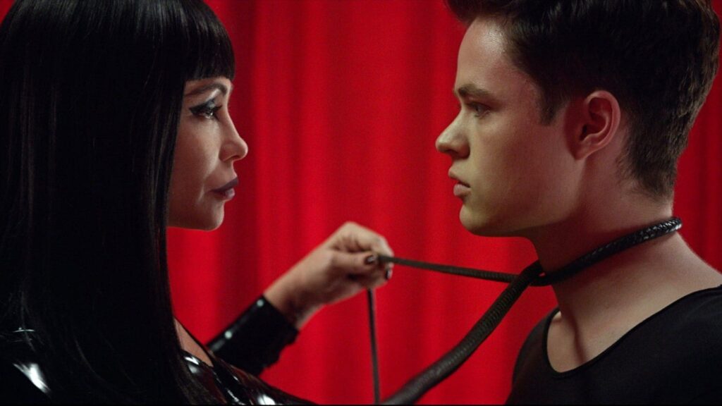 Maggie in dominatrix gear with Charlie