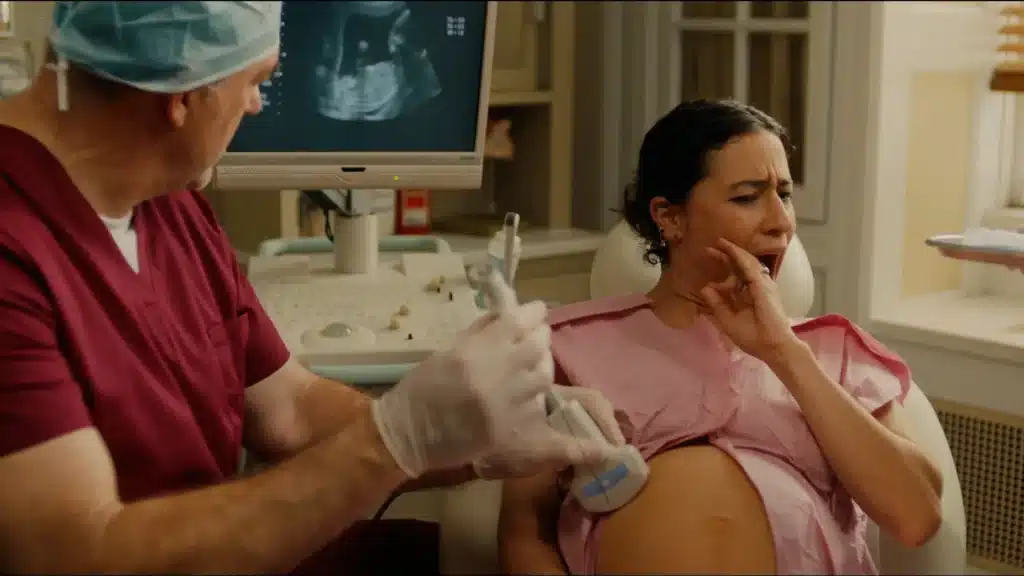 The obstetrician examines the expectant mother