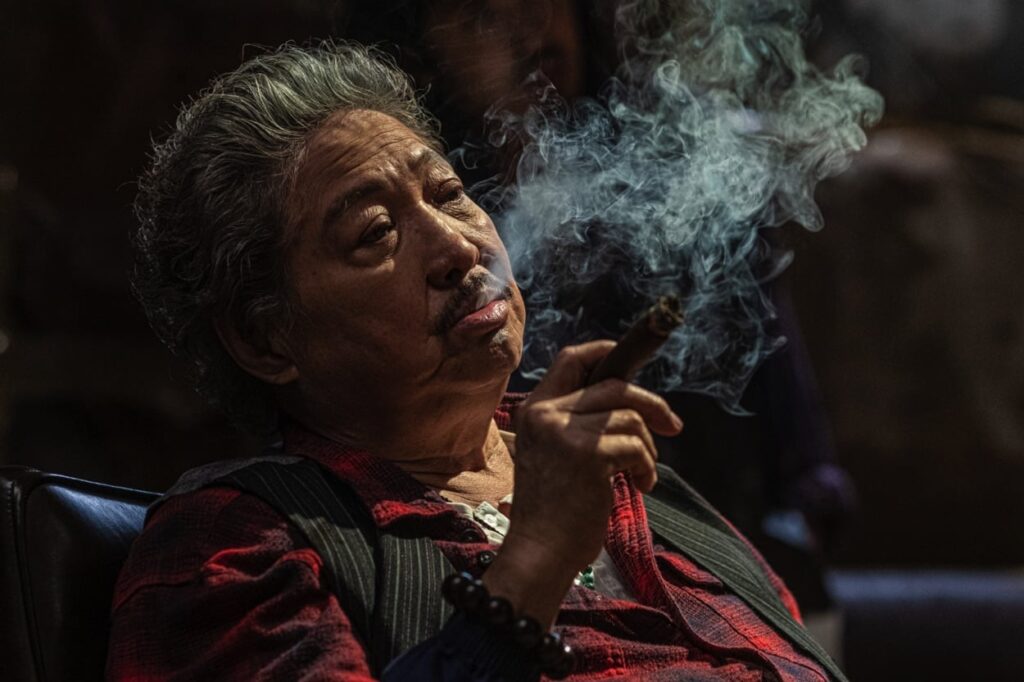 Mr Big (Sammo Hung) smoking