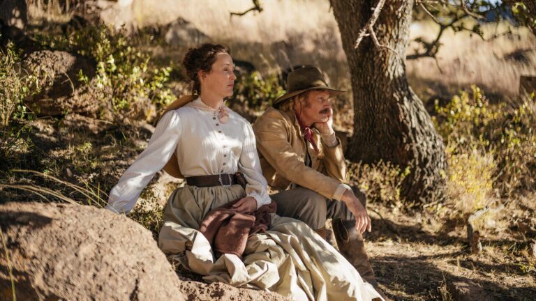 Vivienne and Holger sitting together under a tree