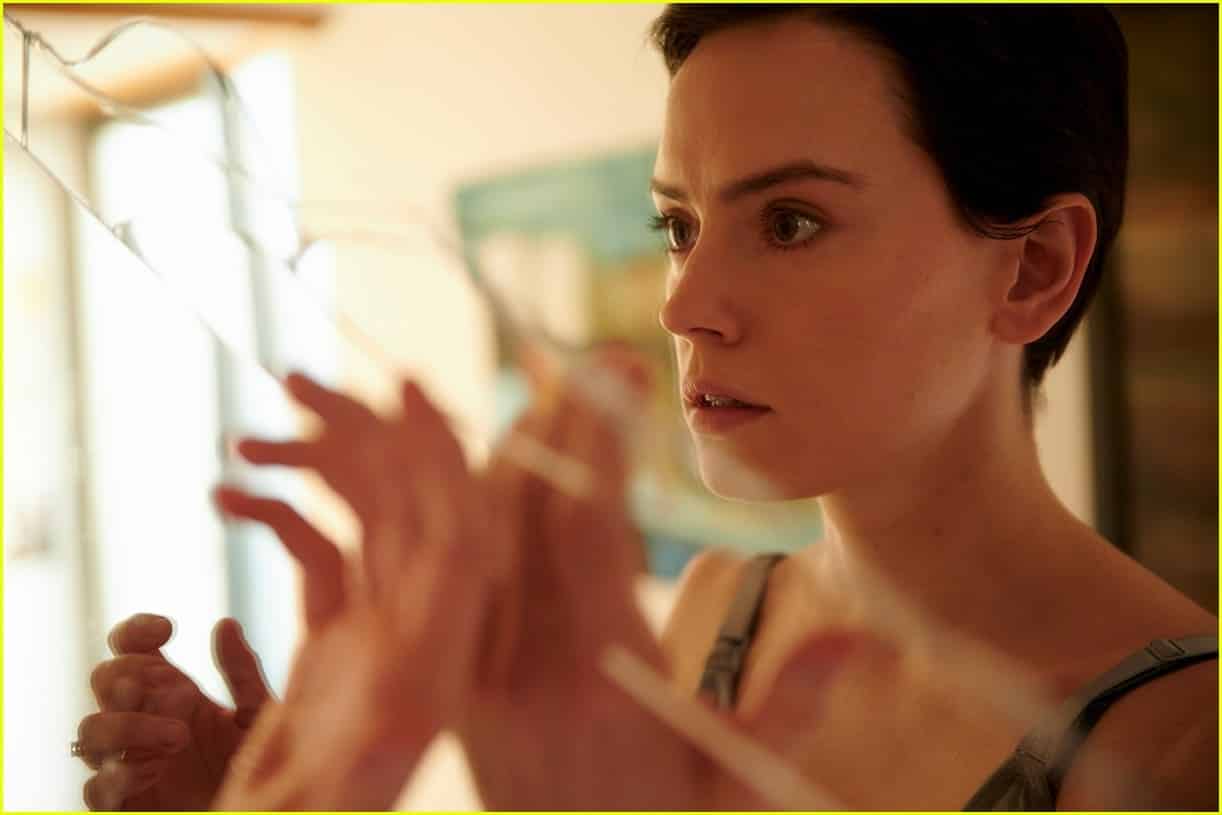 Annette looks into a broken mirror