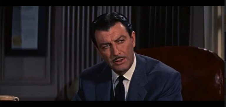 Robert Taylor as crooked lawyer Tommy Farrell