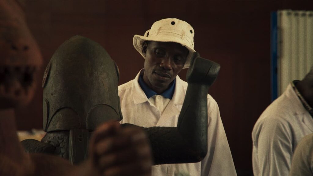 Calixte Biah watches as the artefacts are crated up