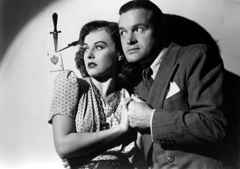 Publicity still of Paulette Goddard and Bob Hope with a knife in the wall to one side