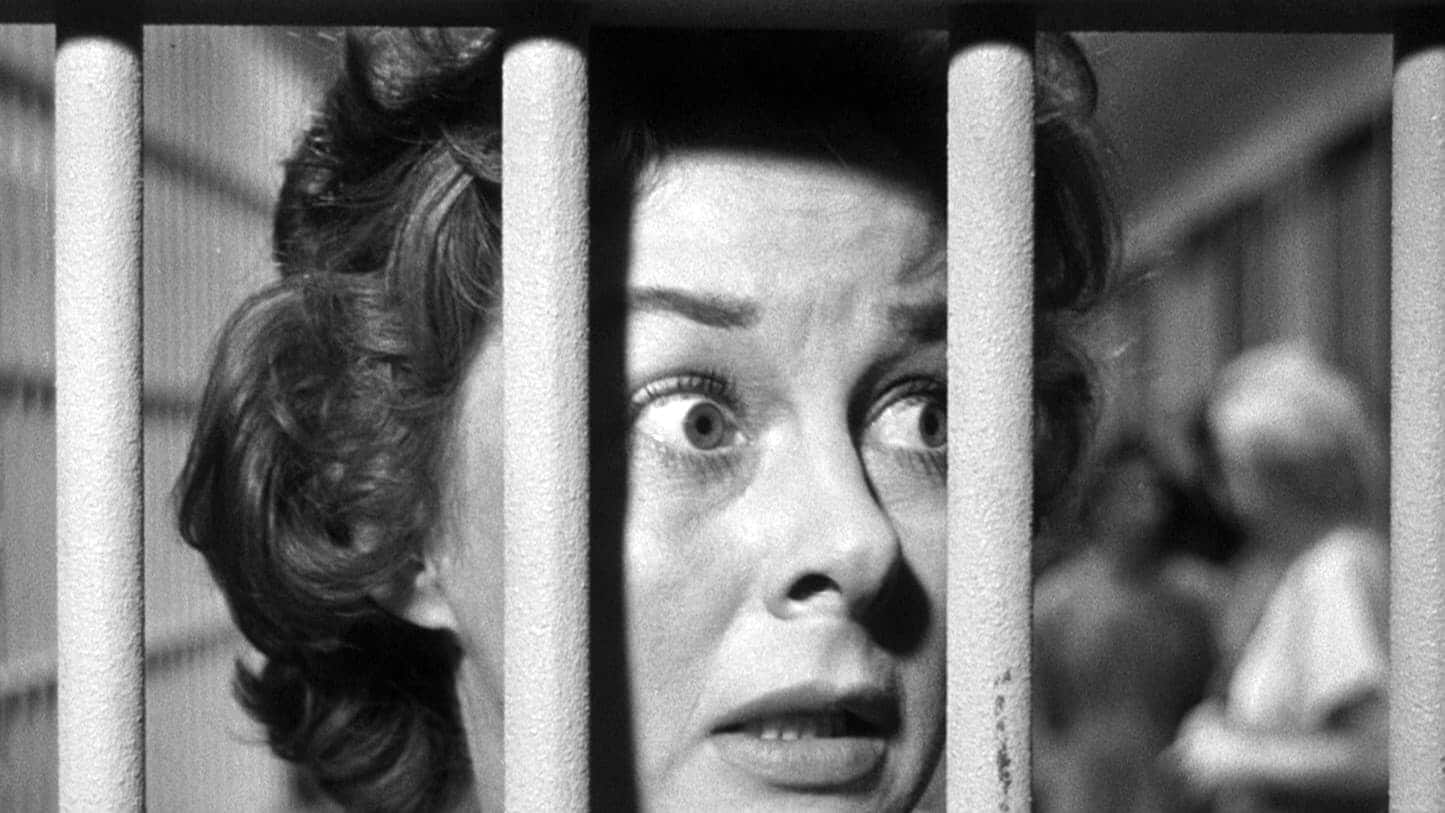 Close up of Susan Hayward looking frantic