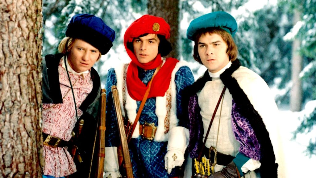 The prince flanked by his two friends