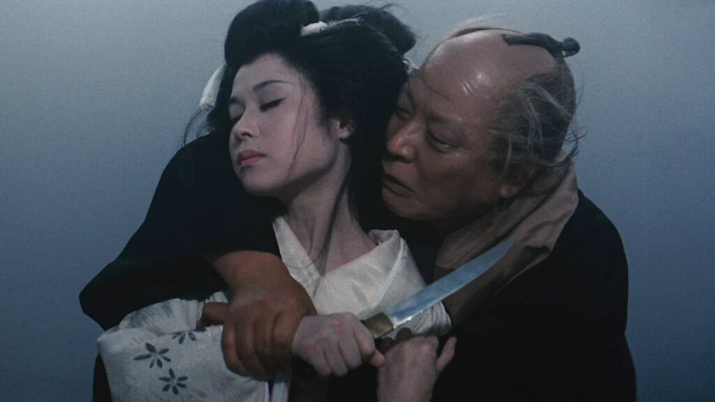 Namiji with Hiromiya holding a knife to her throat