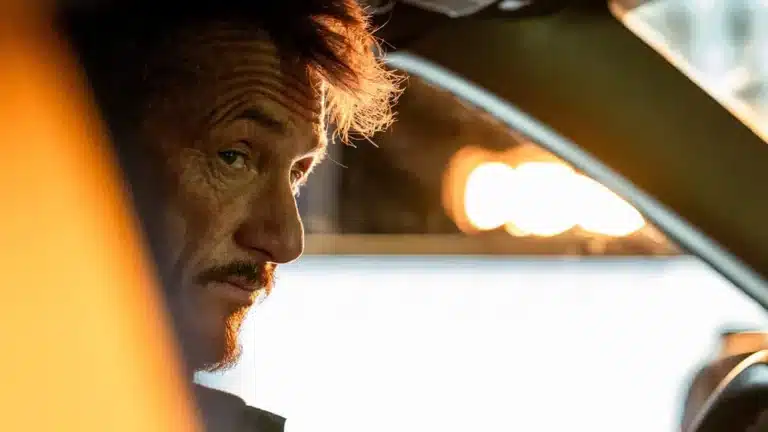 Sean Penn as Clark, the driver, in his cab