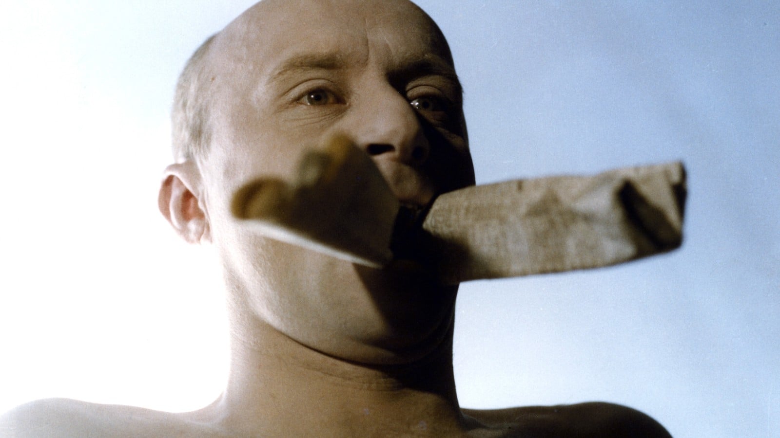 Pernat with newspaper stuffed in his mouth