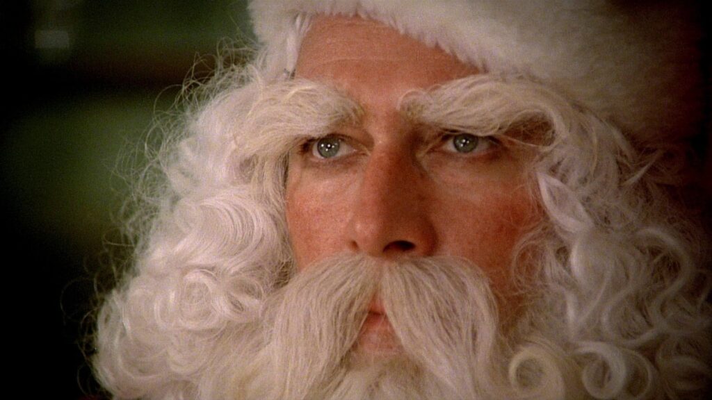 Christopher Plummer disguised as Santa Claus