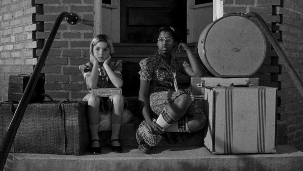 Tatum and PJ Johnson sitting on a stoop