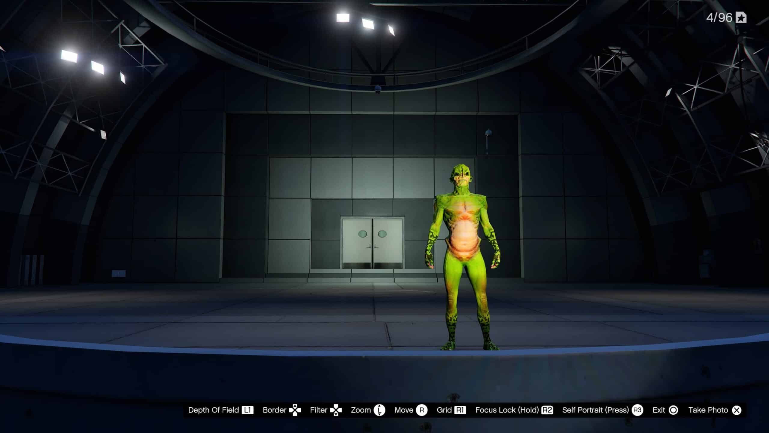 A green alien on stage in Hamlet