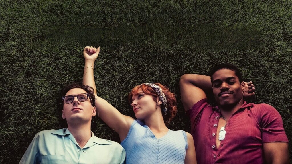 François, Madeleine and Jimmy lying on the grass