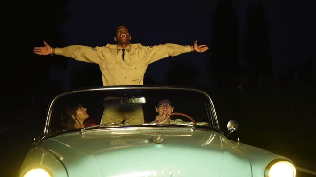 Madeleine, Jimmy and François in a car