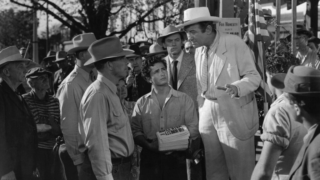 Early days: a white-suited Willie is prevented from speaking by the police