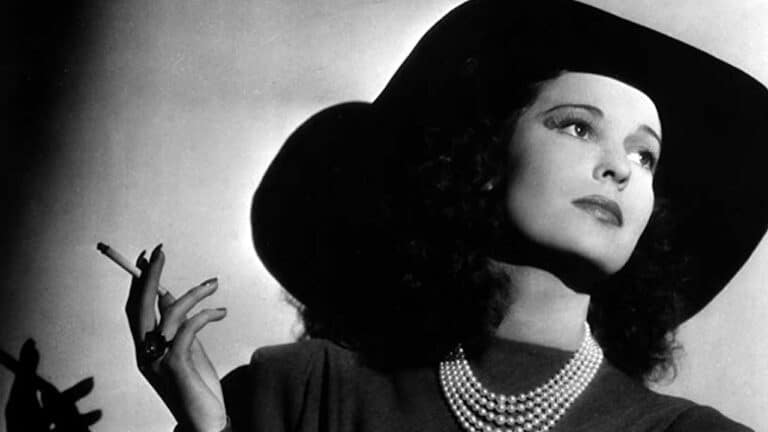Valerie Hobson in a hat and with a cigarette in her hand