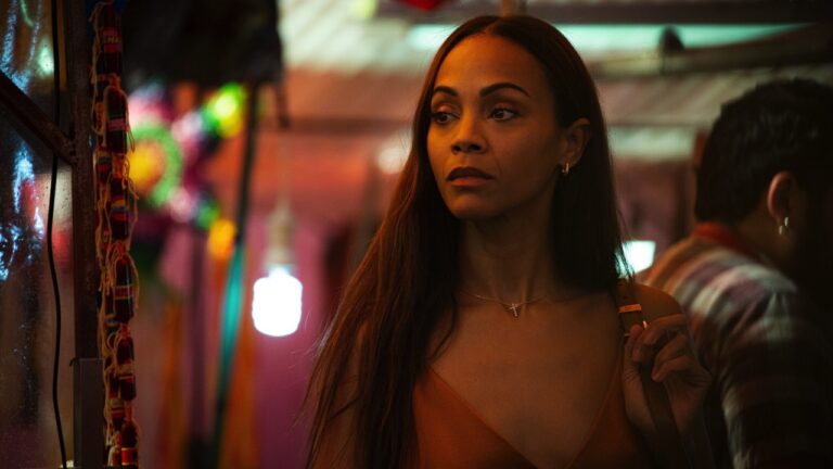 Zoe Saldaña as lawyer Rita