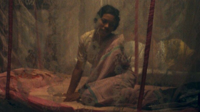 Tampha beneath her mosquito net