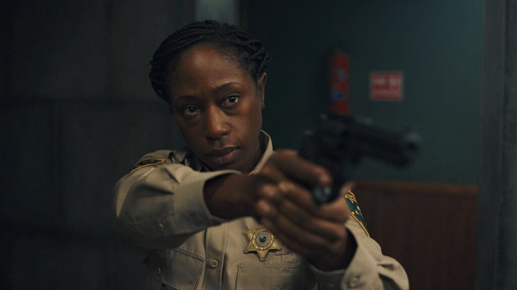 Deputy Tabby aiming a gun