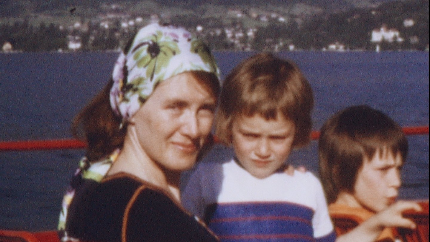 Annie and son in a screenshot from the 1970s