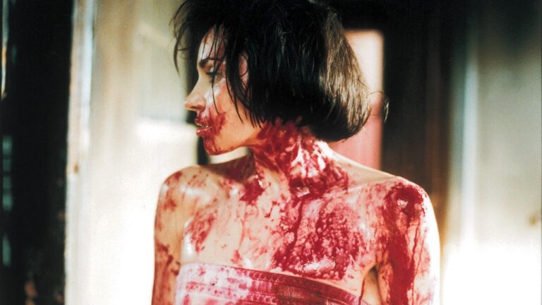Beatrice Dalle covered in blood