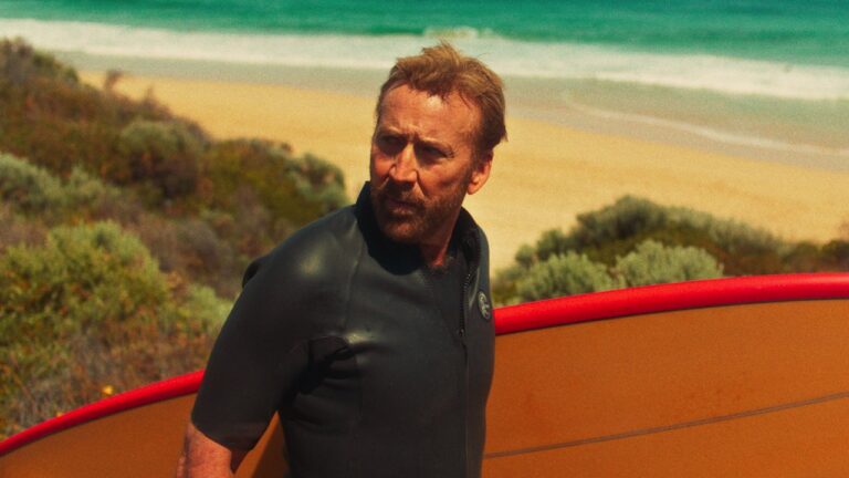 Nicolas Cage with surfboard