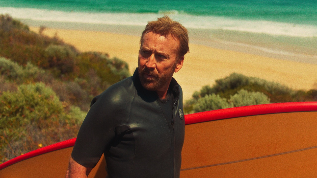 Nicolas Cage with surfboard