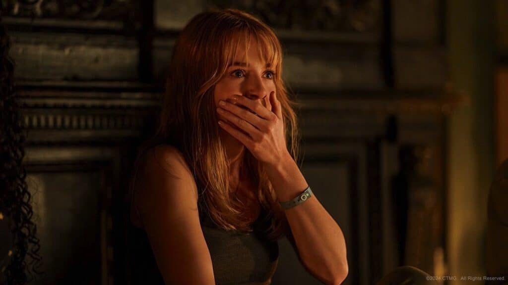 Haley with her hand over her mouth