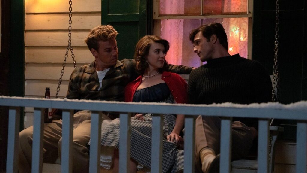 Lee, Muriel and Julius on a swing seat