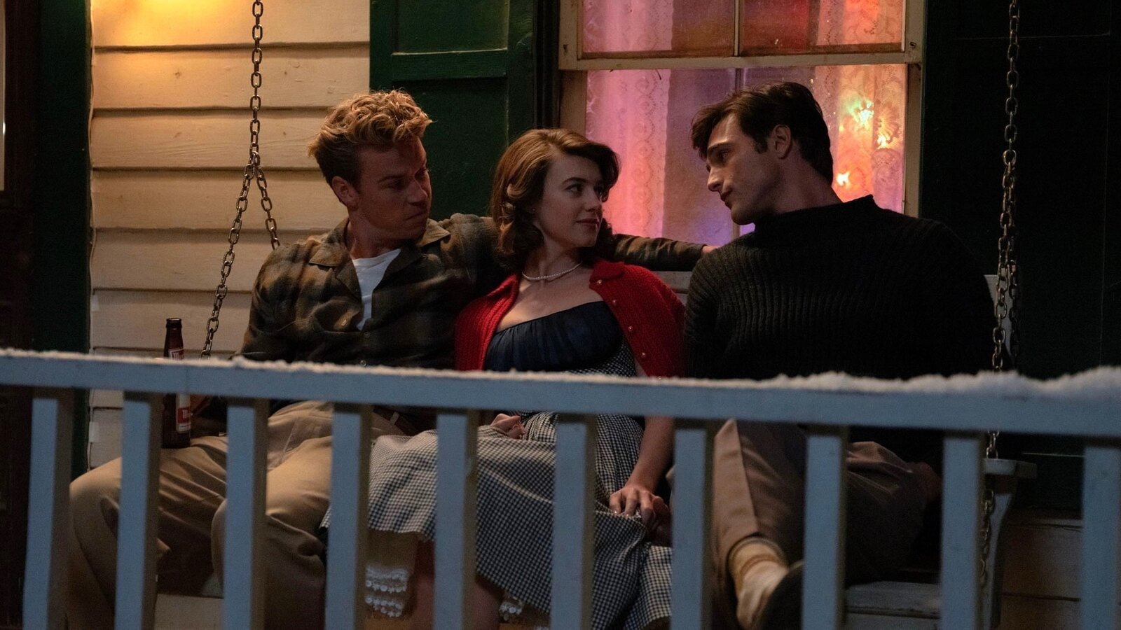 Lee, Muriel and Julius on a swing seat