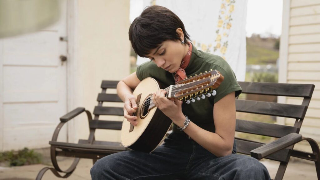 Sandra playing the guitar