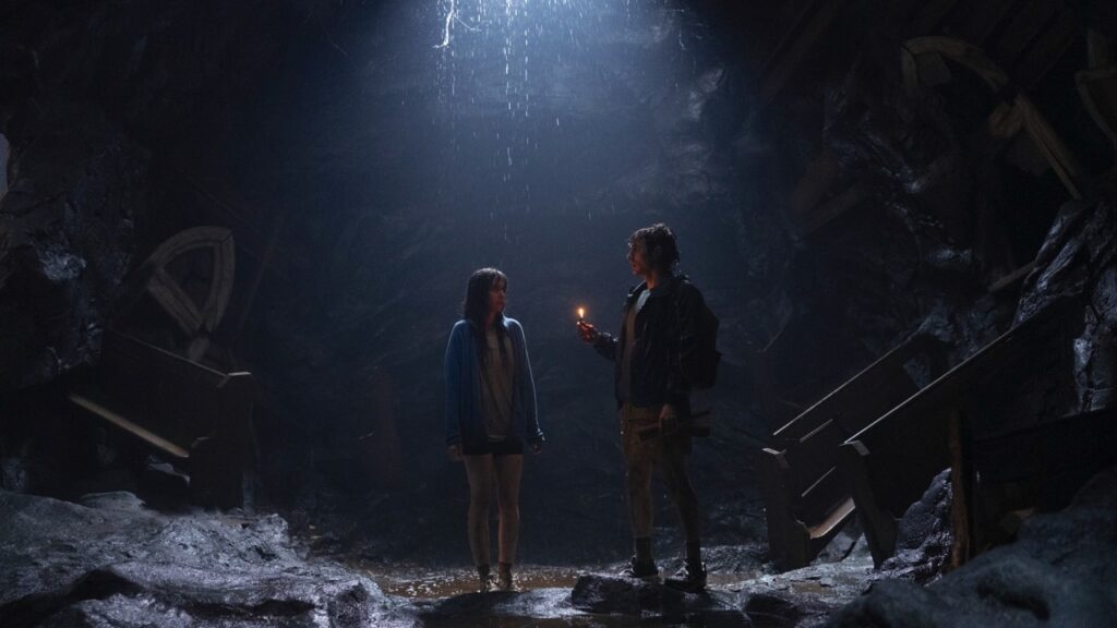 Millie and Tim in the cave where the trouble starts