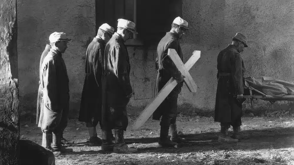 Men assemble with a wooden cross