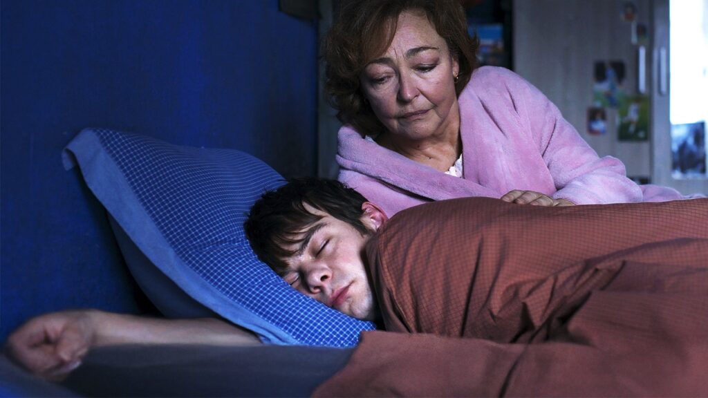 While Jérémie sleeps, widow Martine watches over him