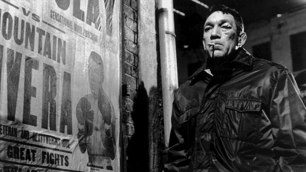 Mountain Rivera next to a poster advertising his fight